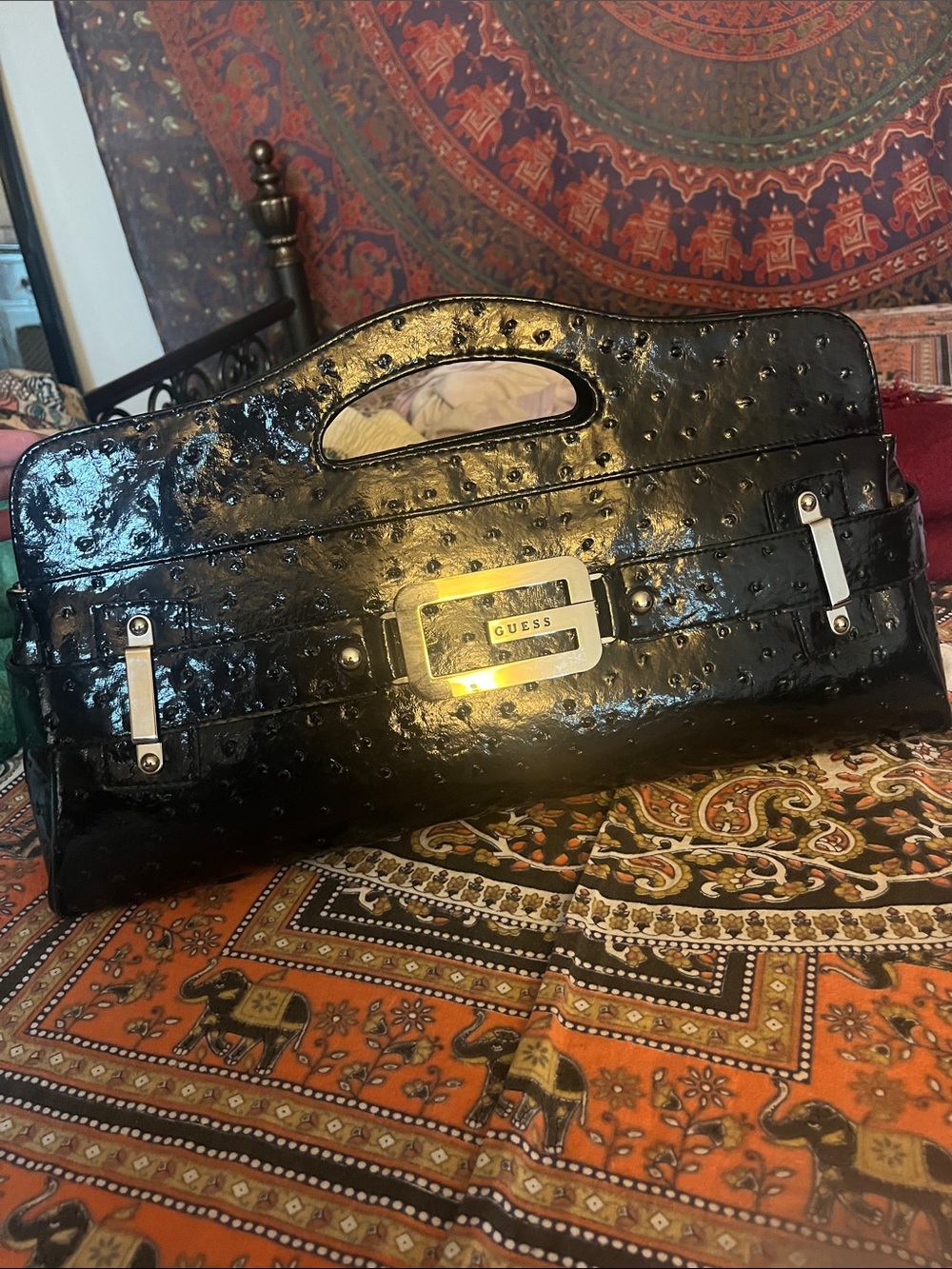 GUESS Black Patent Ostrich-Embossed Top-Handle Clutch with Silver Accents